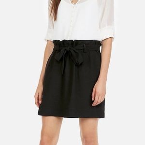 Express: High waisted; pleated skirt with sash.
